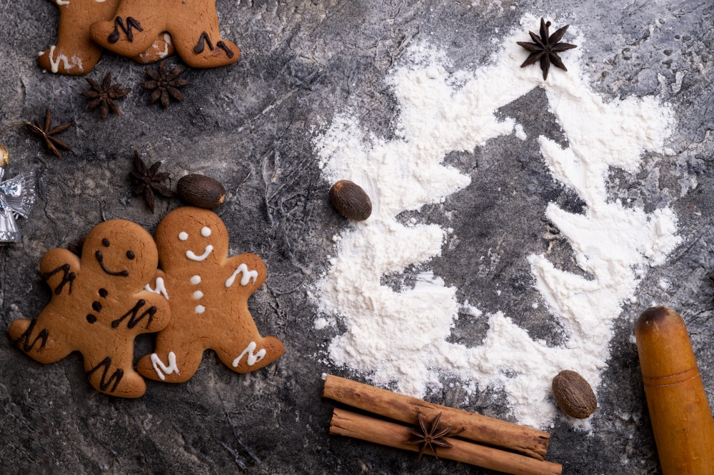 christmas decorative cookies with flour christmas tree. christmas background around grey background