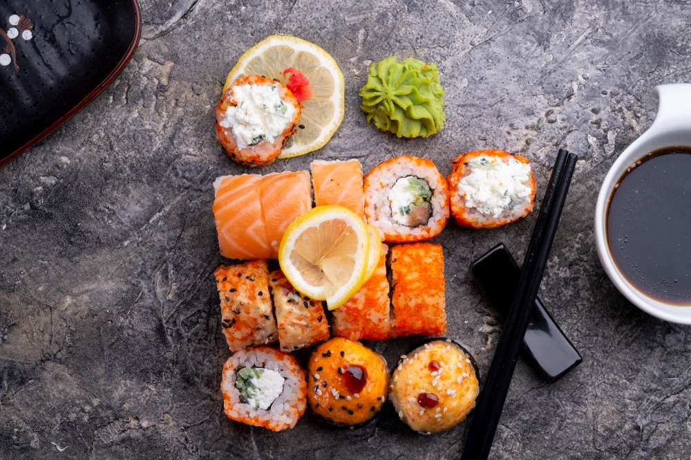 sushi roll set served at grey table. flat lay. close up