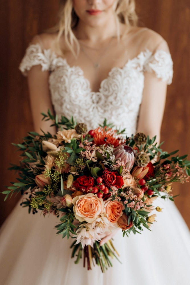 bridal bouquet in red autumn shades of Kenyan dried flowers