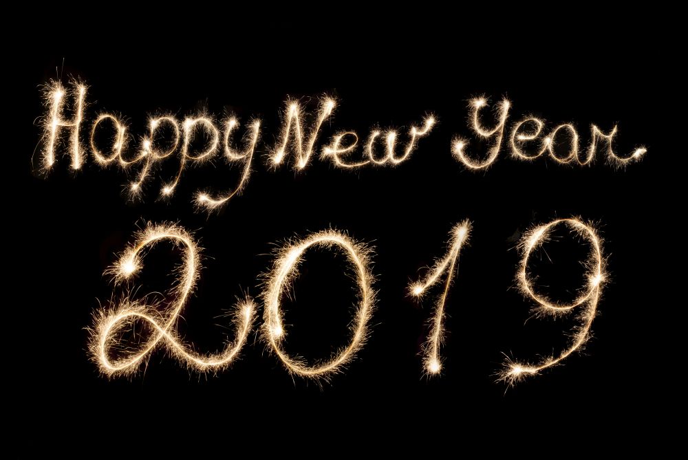 Happy New Year 2019 inscription sparklers on a black background.. Happy New Year 2019 inscription sparklers .