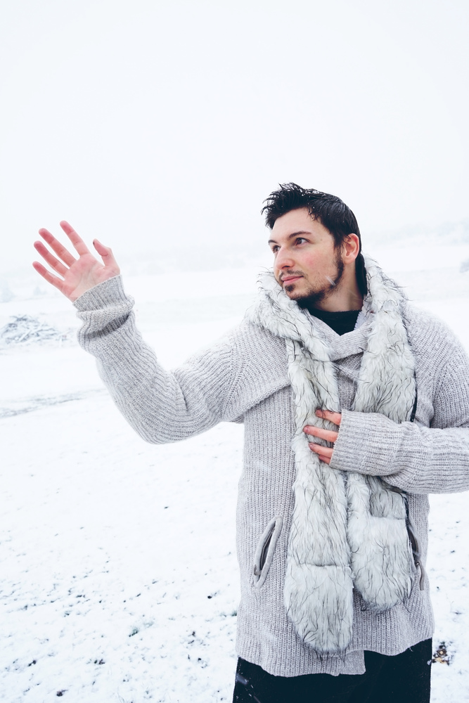 Young and attractive man enjoying a snowy winter day