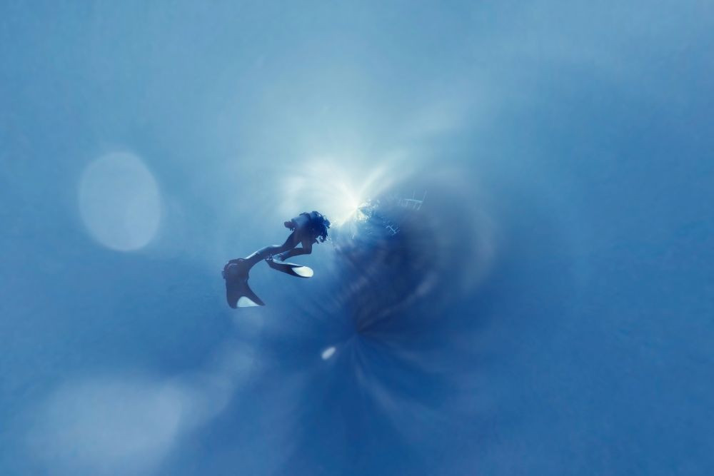 unusual photo diver underwater background