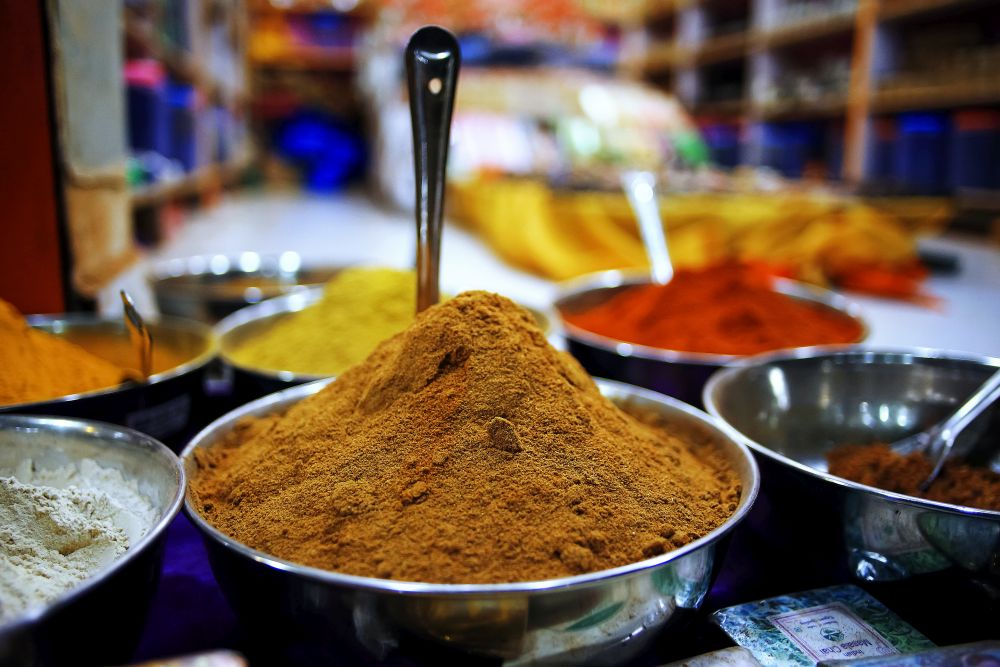 Various Indian condiments in bowls on the table