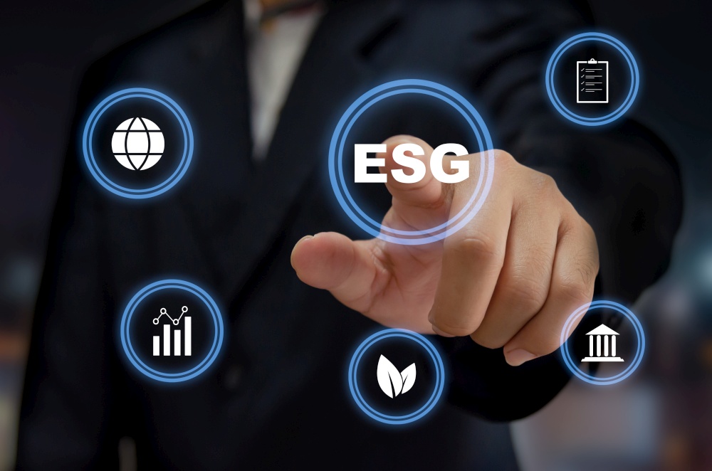ESG environmental social governance investing. Business concept of sustainable development of the organization.Man hand touching ESG word with icon virtual screen.. ESG environmental social governance