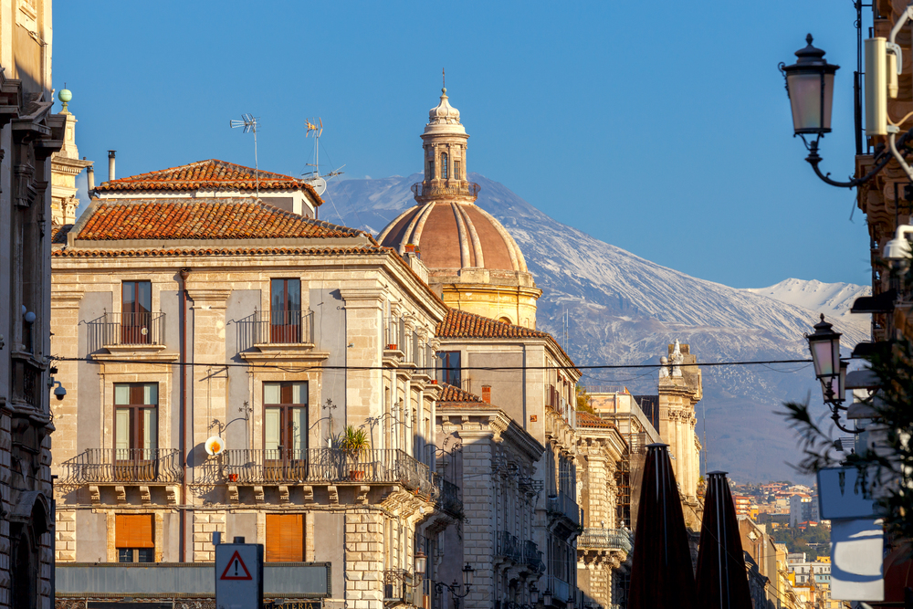 Cityscape on the background of the volcano Etna. Catania Sicily. Italy.. Catania. Etna volcano over the city.