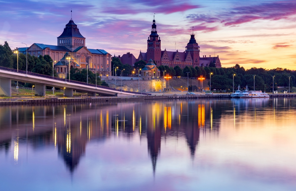 Scenic view of the embankment and the old town at sunrise. Szczecin. Pomerania. Poland.. Szczecin. City embankment in the historical part of the city at dawn.