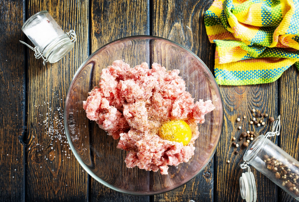 Minced meat with egg and spice and salt prepared for cooking