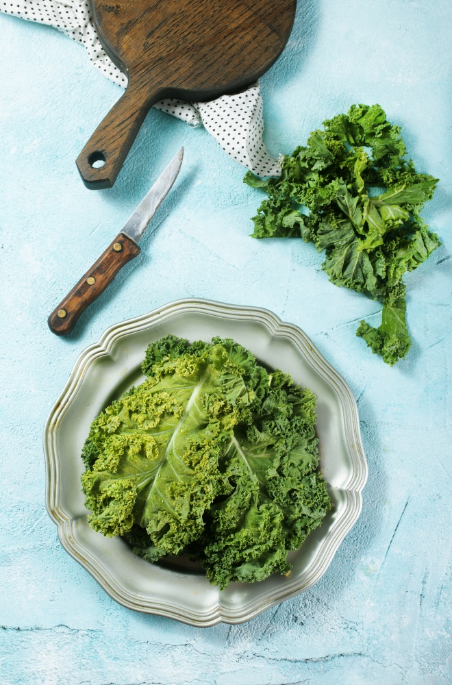 Cut Fresh healthy savoy cabbage on cutting board