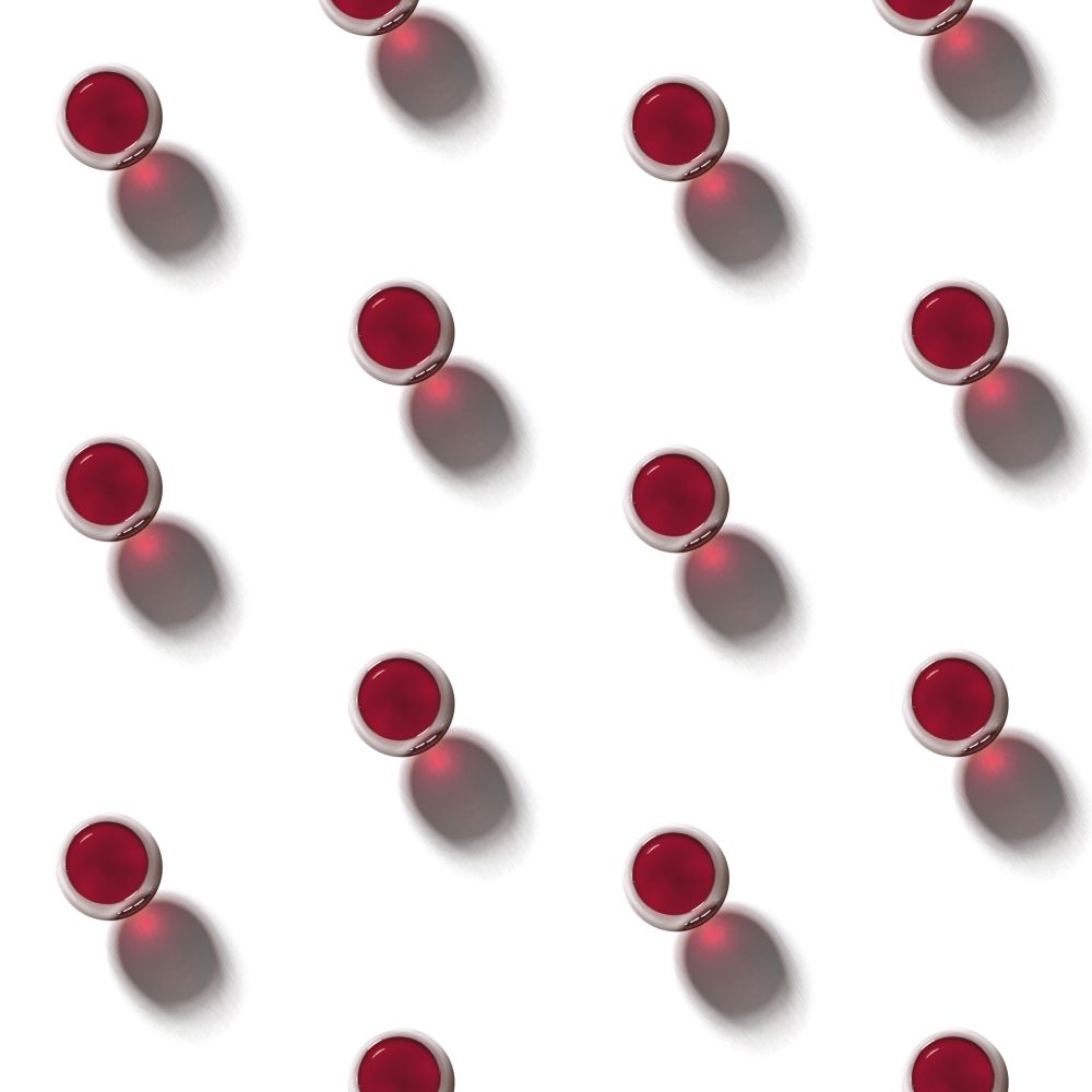 flatlay pattern made of glasses of red wine on a white background. flatlay pattern made of wine glasses with red wine