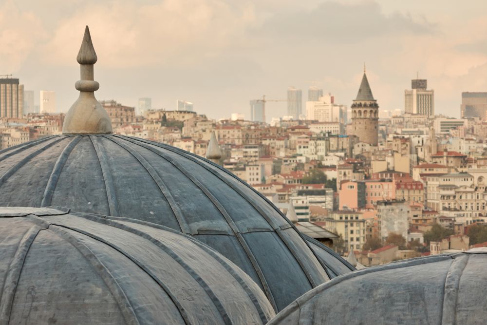 close-up of the mosque dome, view of the city, the Galata tower in the distance Istanbul, Turkey. View of dome of the mosque, Istanbul, Turkey