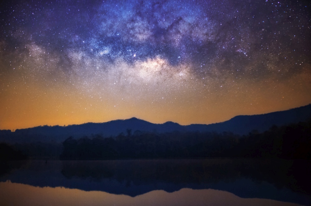 Panorama landscape Milky way galaxy with stars and space dust in the universe over mountain, long exposure.. Milky Way over mountain.