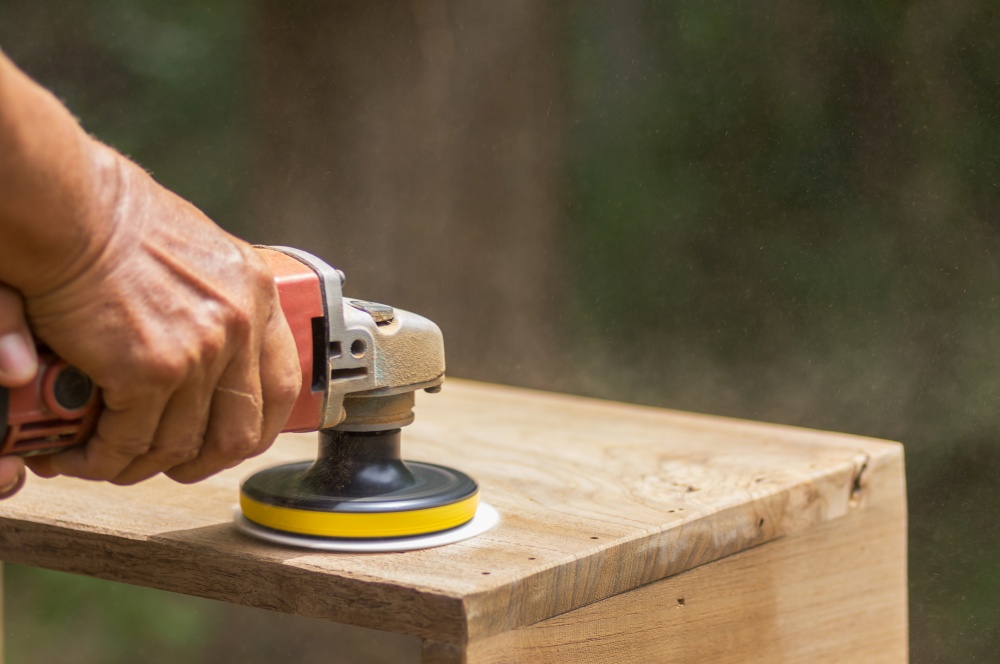 Sanding machine, The carpenter uses a polishing machine to smooth the wood.. Sanding machine.