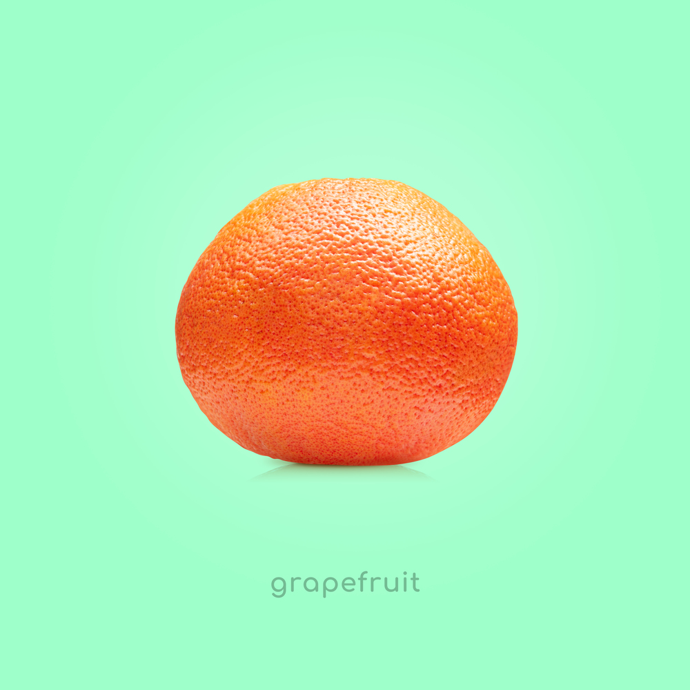 Grapefruit fruit isolated on mint background. Grapefruit fruit