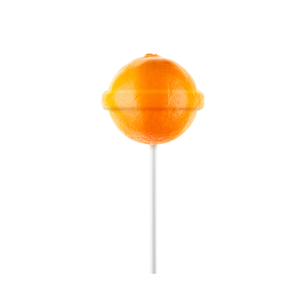 Lollipop orange isolated on white background. Creative candy idea. Lollipop orange