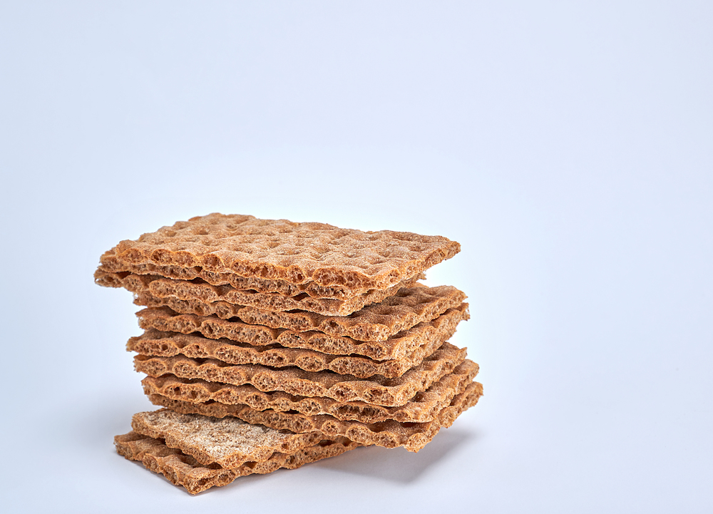 A stack of rectangular snack bars on a white background, copy space