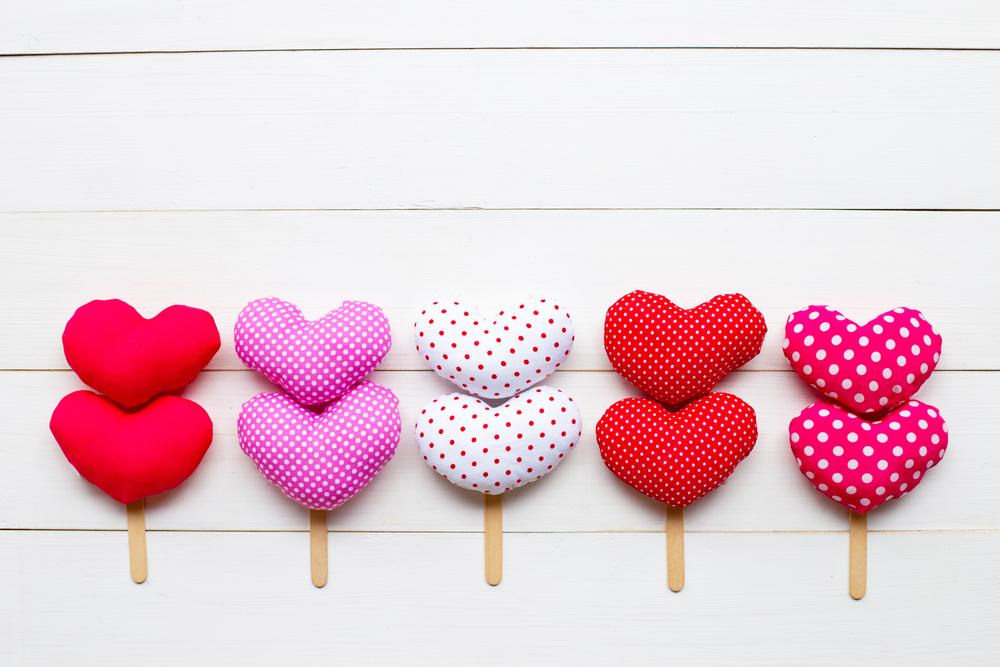 Valentine&rsquo;s hearts on white wooden background. Copy space
