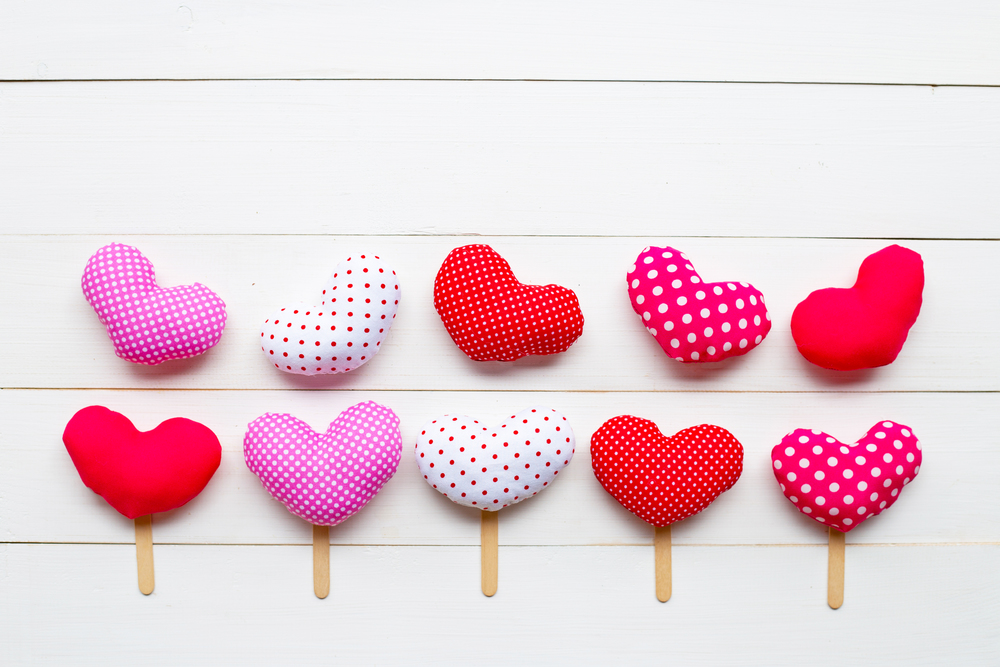 Valentine&rsquo;s hearts on white wooden background. Copy space