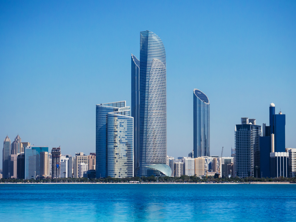Beautiful blue sea with Abu Dhabi skyline and modern buildings cityscape  view from marina island
