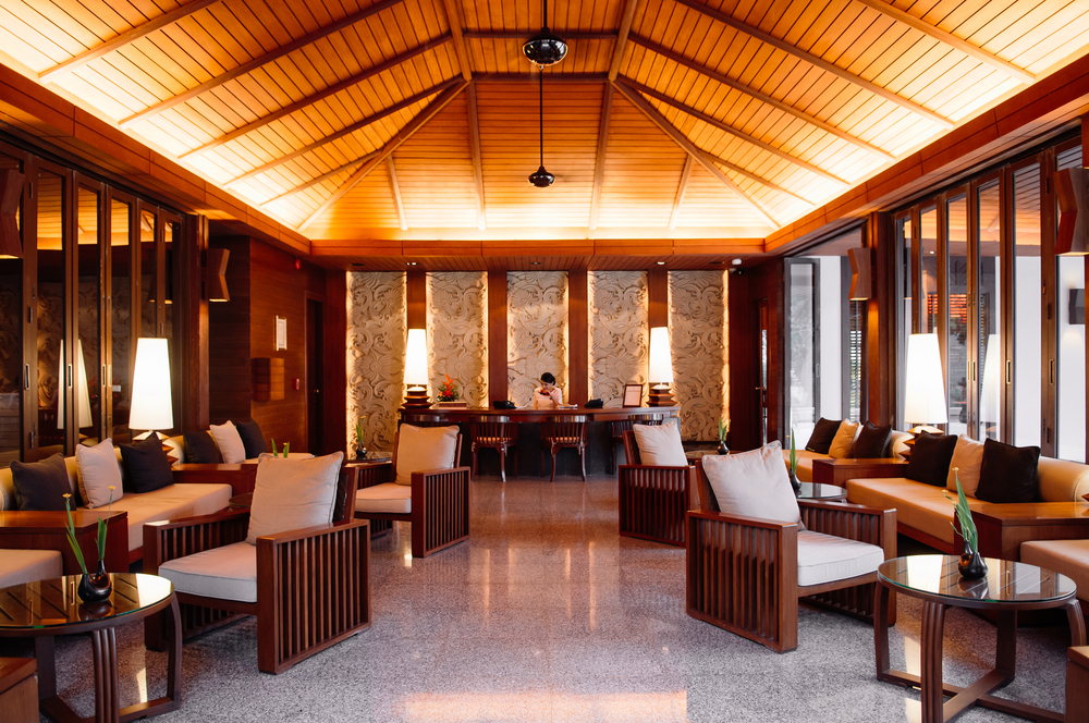 MAY 17, 2014 Krabi, THAILAND - Asian luxury style hotel lobby lounge with contemporary wooden furnitures, chairs, tables , pillows and Thai style decoration