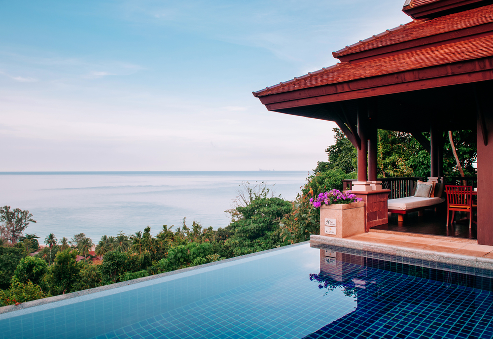 MAY 18, 2014 Krabi, THAILAND - Hill top luxury villa infinity edge pool with seascape, Koh Lanta tropical resort outdoor space in summer