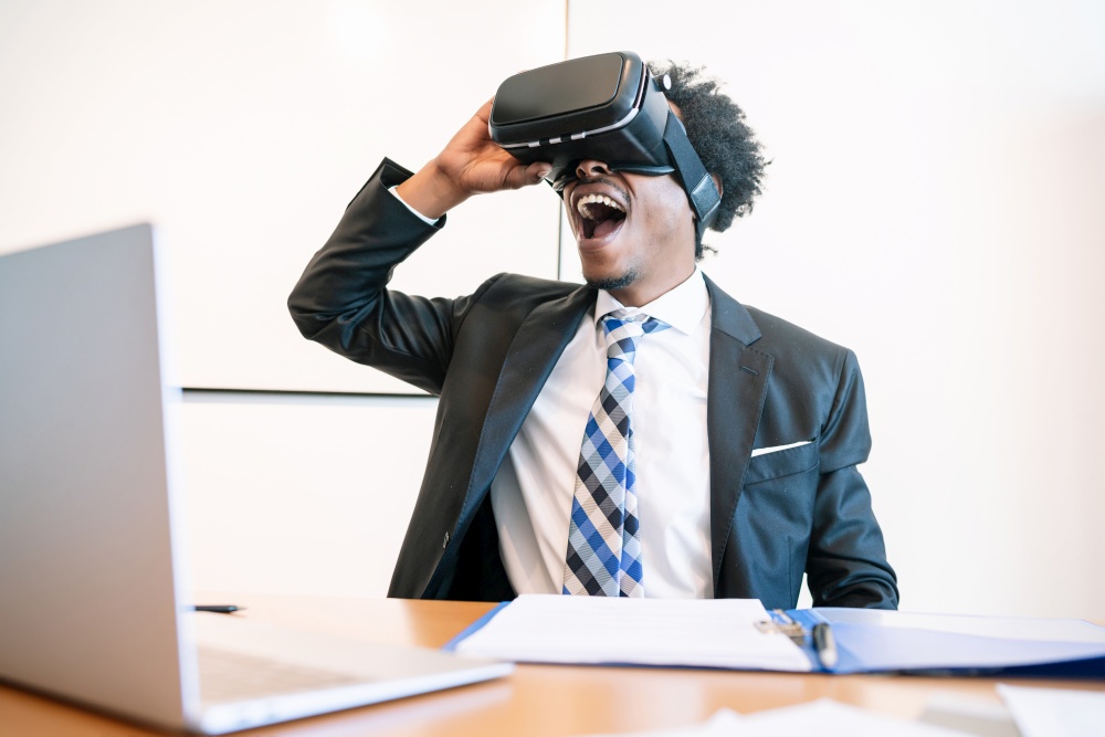 Professional businessman using virtual reality headset in modern office. Business and technology concept.