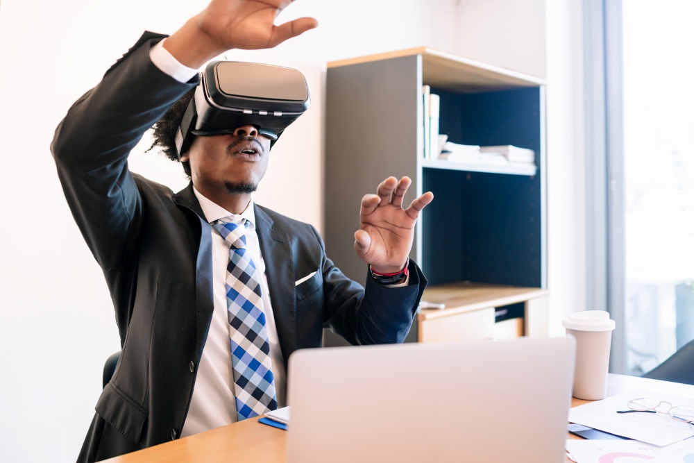 Professional businessman using virtual reality headset in modern office. Business and technology concept.
