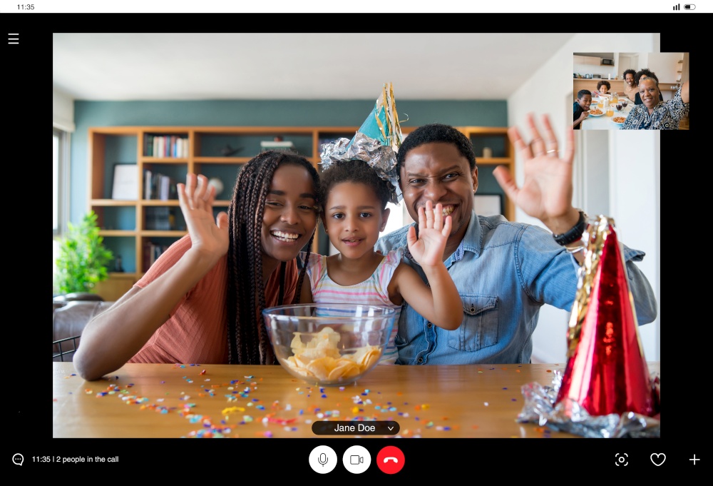 Portrait of a family celebrating birthday online on a video call while staying at home. New normal lifestyle concept.