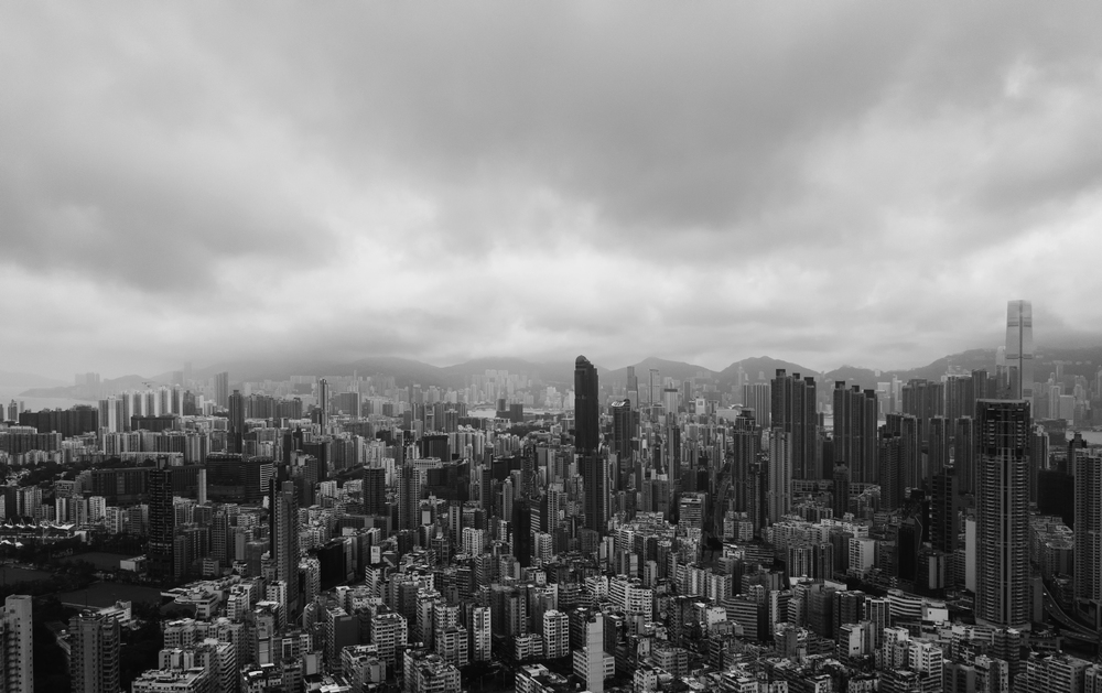 Black and white image of aerial view of Hong Kong apartments in cityscape background, buildings in Sham Shui Po District. Residential district in smart city in Asia.
