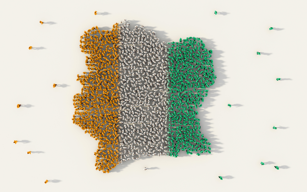 Large group of people forming Cote Divoire map and national flag in social media and community concept on white background. 3d sign symbol of crowd illustration from above gathered together