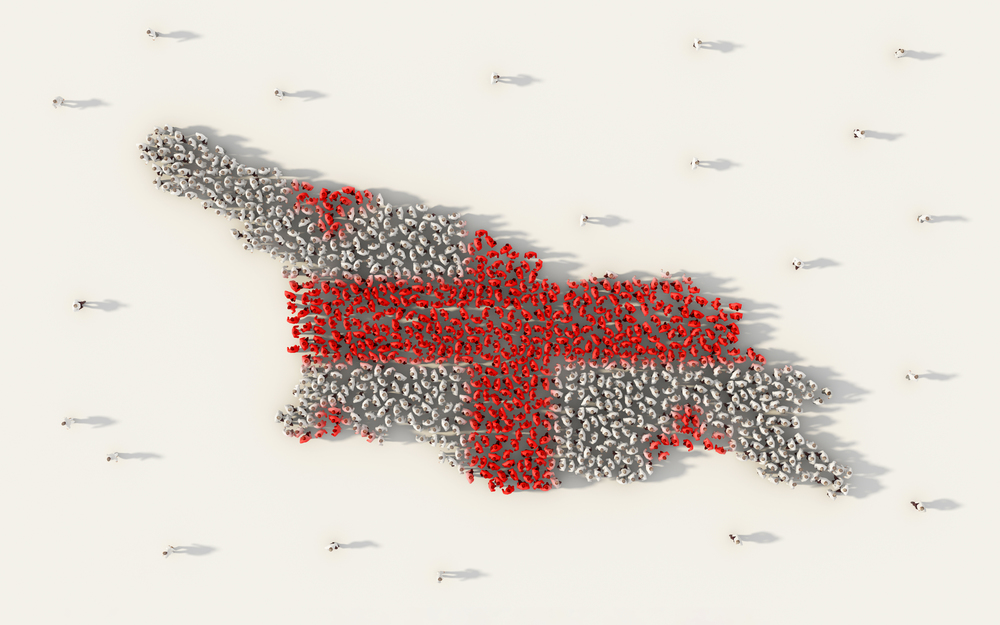 Large group of people forming Georgia country map and national flag in social media and community concept on white background. 3d sign symbol of crowd illustration from above gathered together
