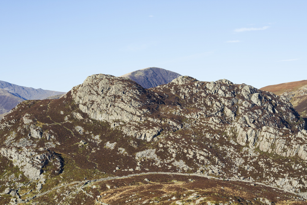 Rocky mountain peaks of Snowdonia with blue sky, Wales. Rocky texture