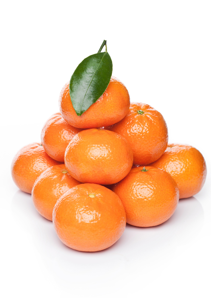 Fresh organic mandarins tangerines fruits with leaves on white background