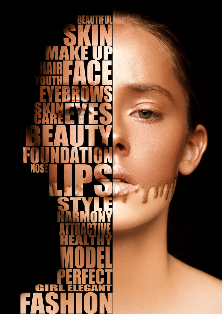 Beautiful woman portrait skincare concept with transparent letters on face on black background