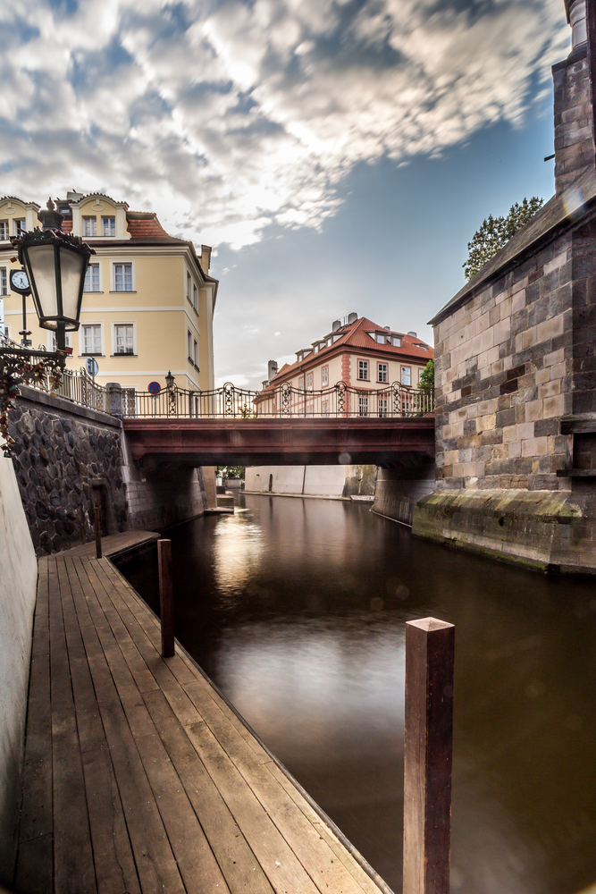 View below the Charles Bridge on the Certovka River and the colorful houses of Kampa&quot;s Kampa Island