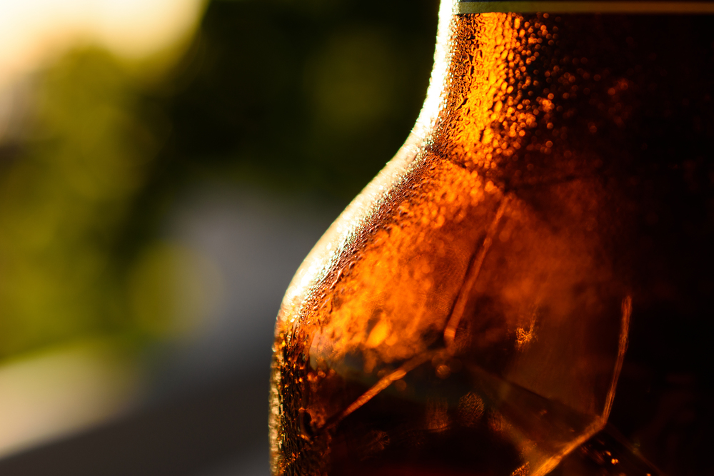 Refreshing Brown Cold Beer Bottle Covered With Condensation