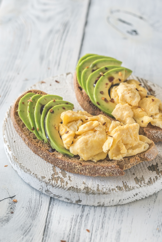 Sandwiches with avocado and scrambled eggs