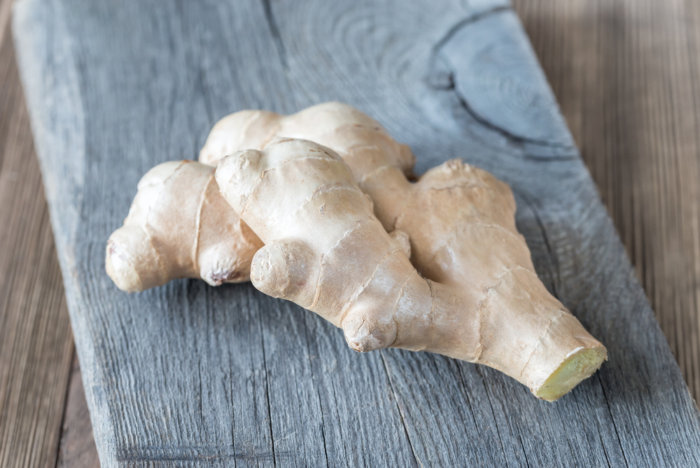 Fresh ginger on the wooden board