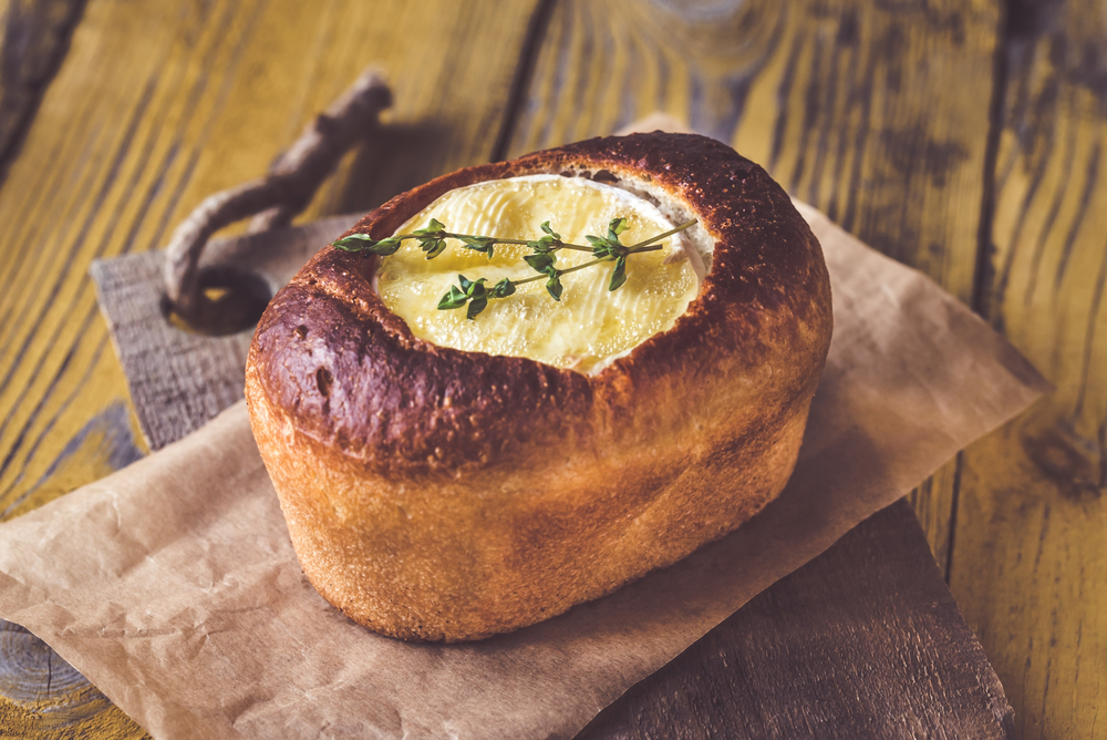 Camembert bread bowl decorated with fresh thyme