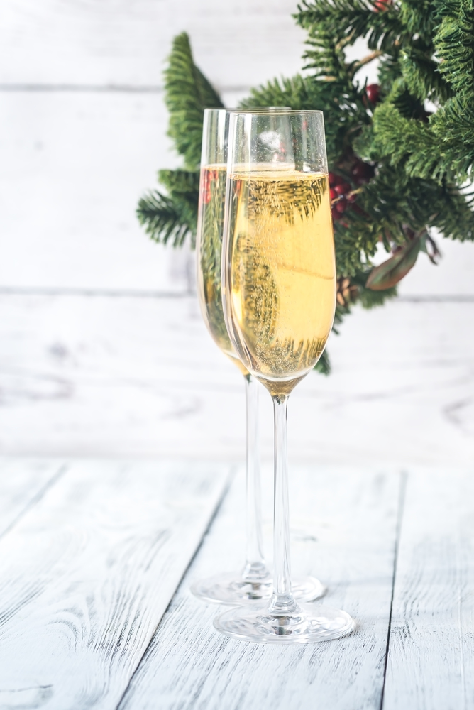 Glasses of champagne with Christmas tree