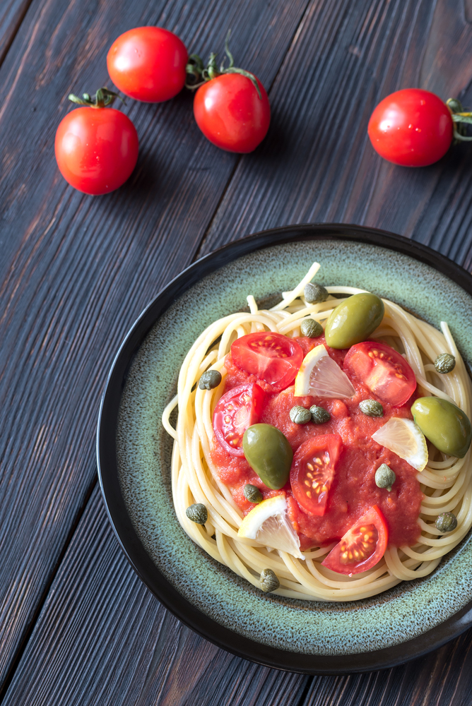 Pasta with tomato sauce, olives and capers
