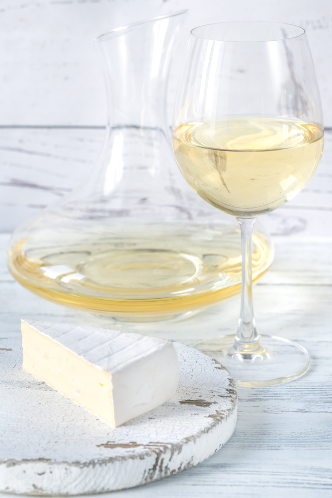 Glass of white wine with cheese