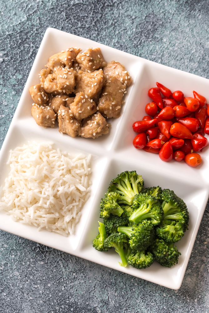 Broccoli and chicken stir-fry with rice and chili