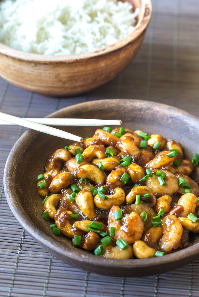 Portion of cashew shrimp stir-fry with rice