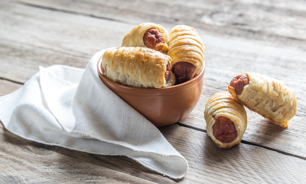 Bowl with sausage rolls