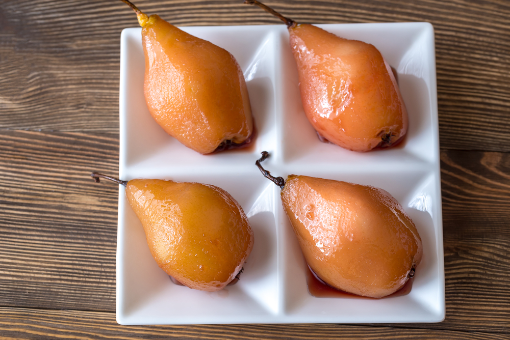 Poached pears in rose wine on the plate