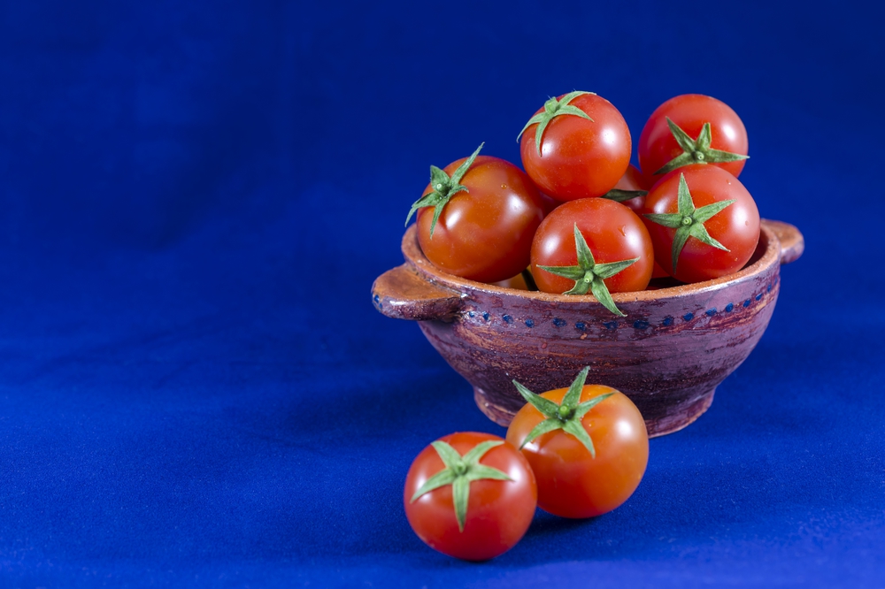 Cherry tomatoes in clay bowl