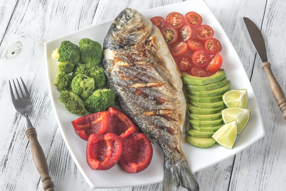 Grilled sea bream fish with vegetables