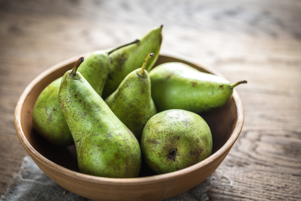Fresh pears in the rustic bowl