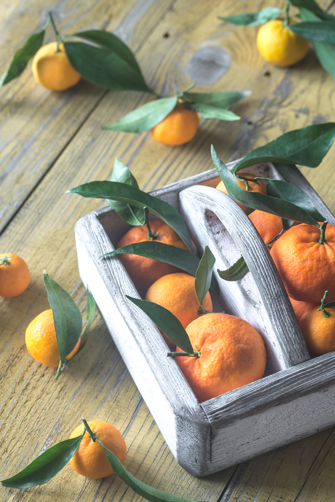 Fresh tangerines in the wooden box