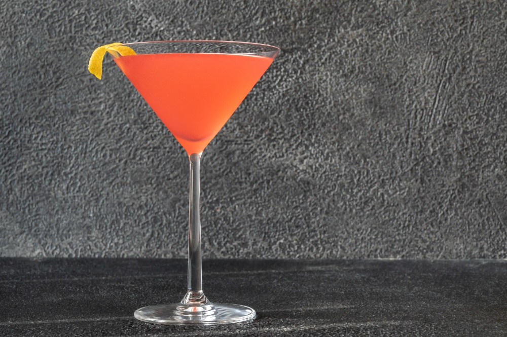 Cosmopolitan cocktail garnished with dried orange slice